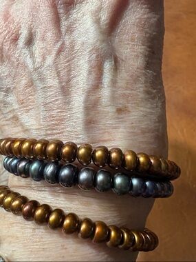 3 Natural Colored Pearls Cuffs 2 Brown 1 Peacock color 
Never worn very stretchy